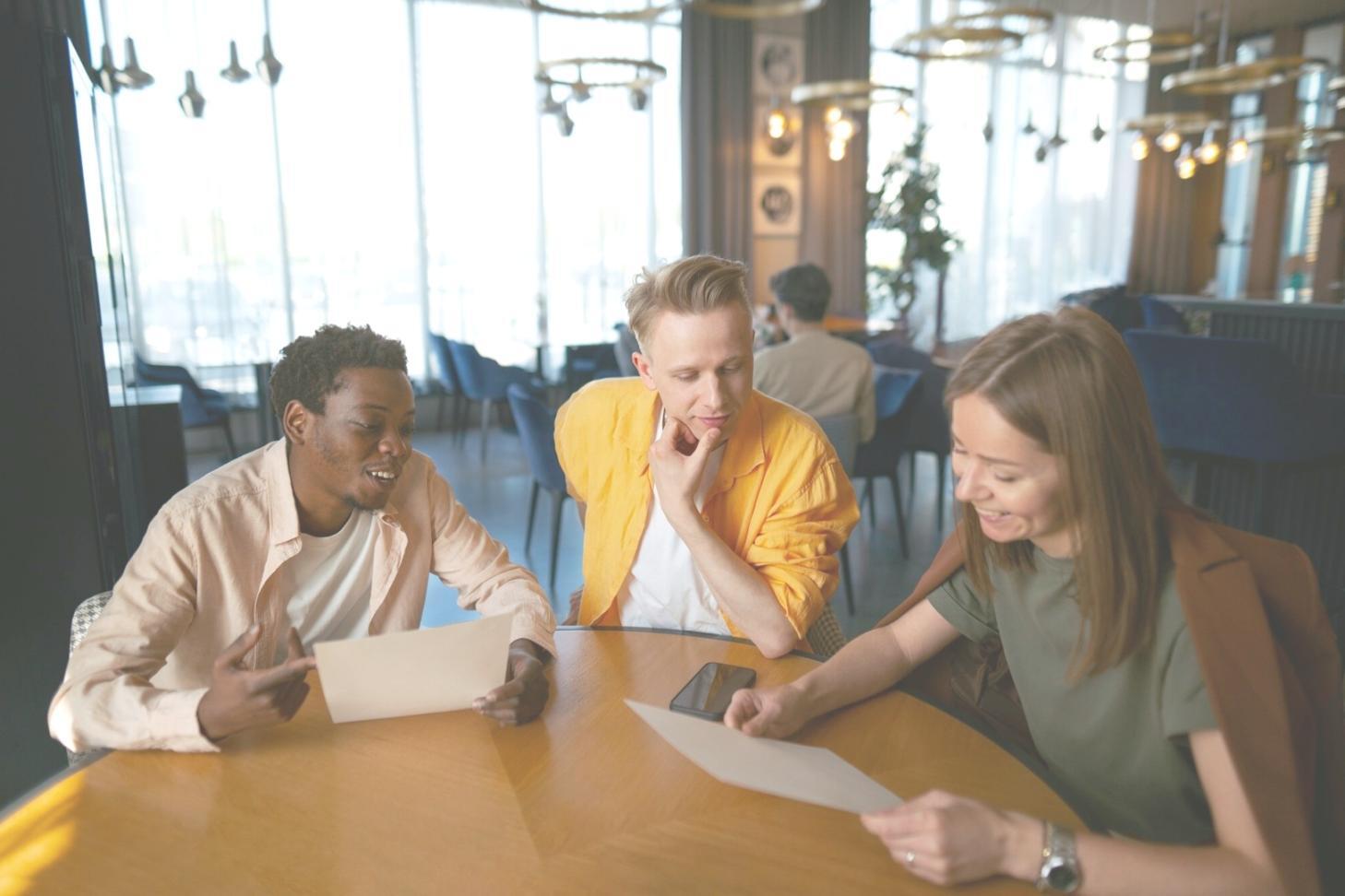 Professional mentoring session with financial documents and analytics tools